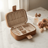 Jewellery travel case open on a marble vanity with gold jewellery and soft neutra The soft life Jewellery Travel Casel tones